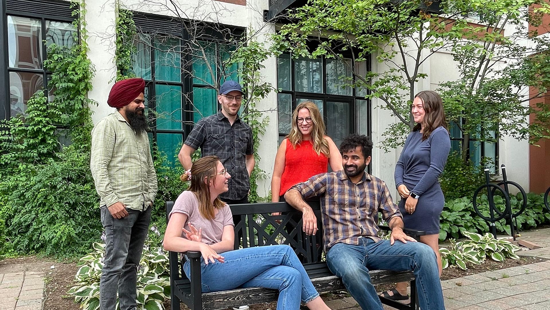 Group of people around a bench